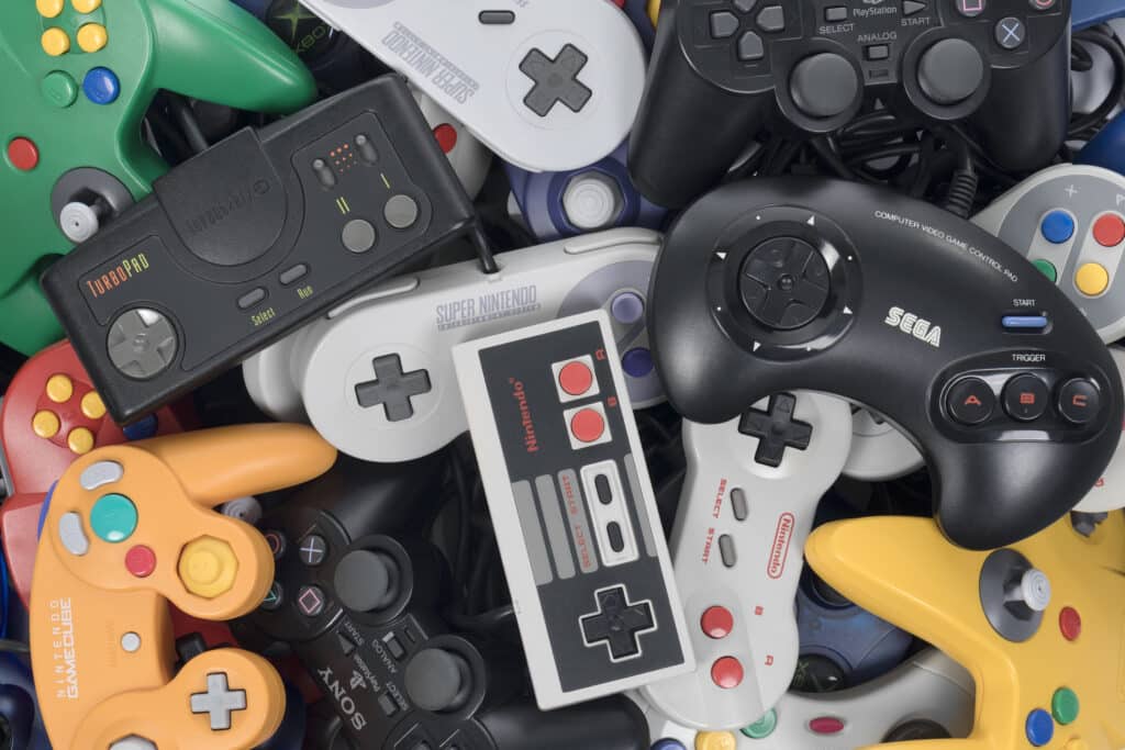 Stack of Retro Video Game Controllers